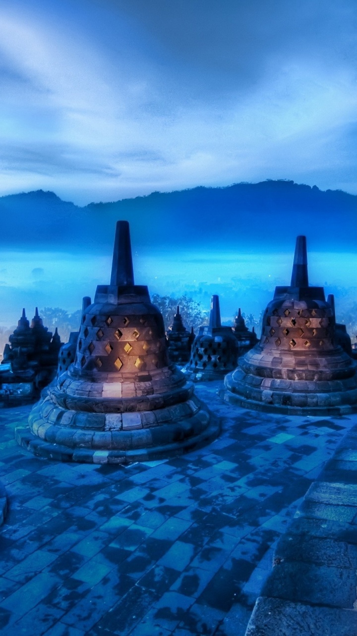 Brown and Blue Concrete Building Under Blue Sky. Wallpaper in 720x1280 Resolution