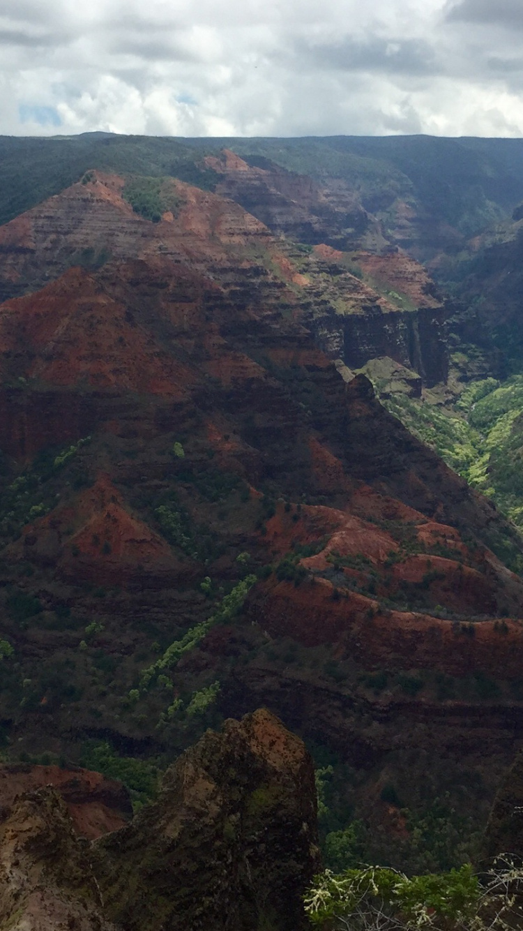 Green and Brown Mountains Under White Cloudy Sky During Daytime. Wallpaper in 750x1334 Resolution