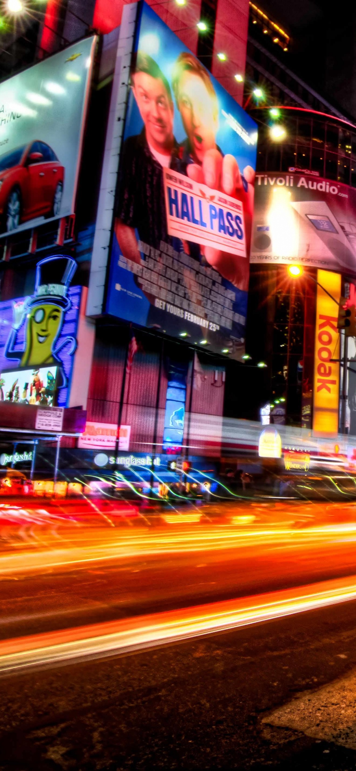 Cars on Road Near Buildings During Night Time. Wallpaper in 1242x2688 Resolution