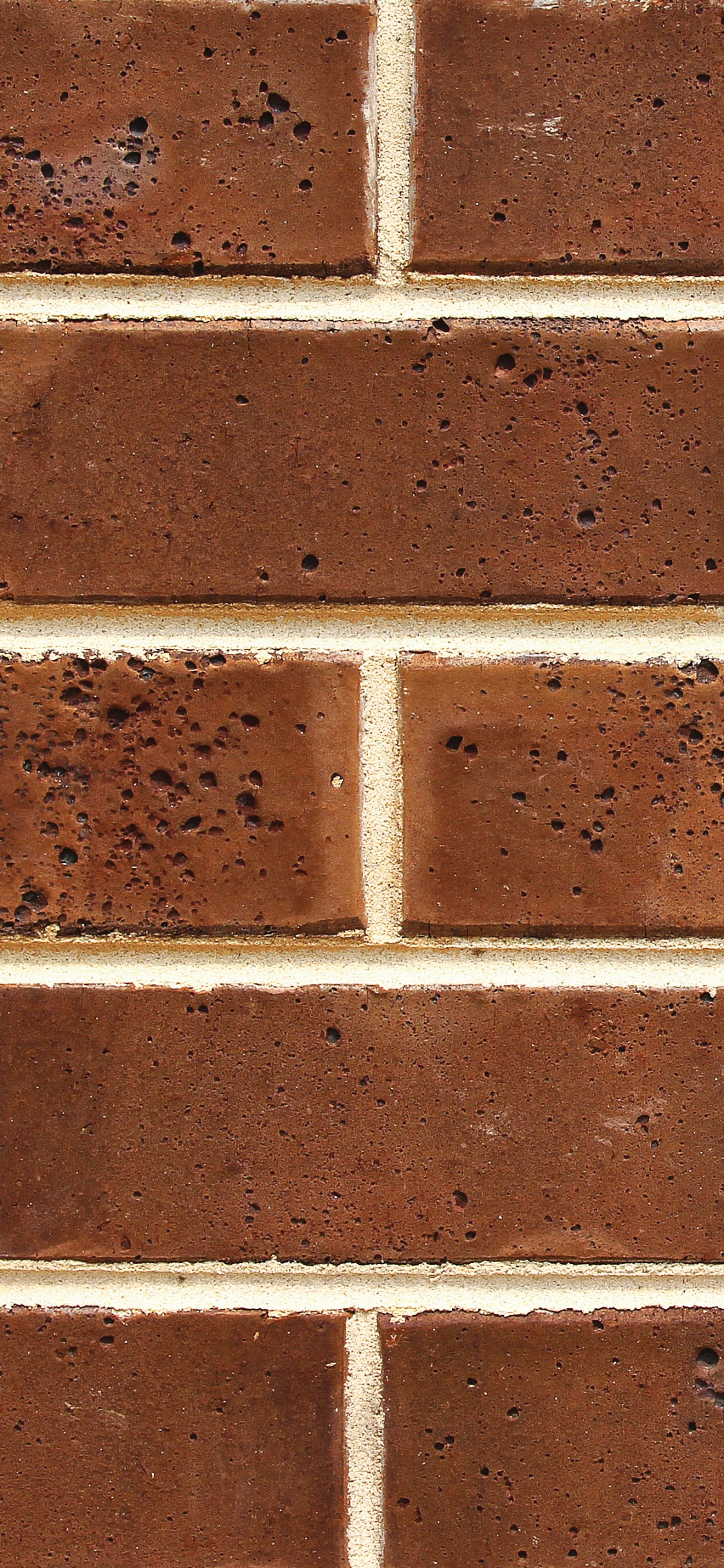 Brown and White Brick Wall. Wallpaper in 1125x2436 Resolution