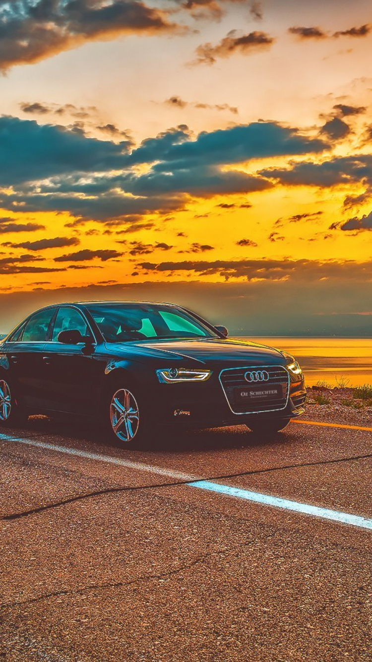 Black Car on Road During Sunset. Wallpaper in 750x1334 Resolution