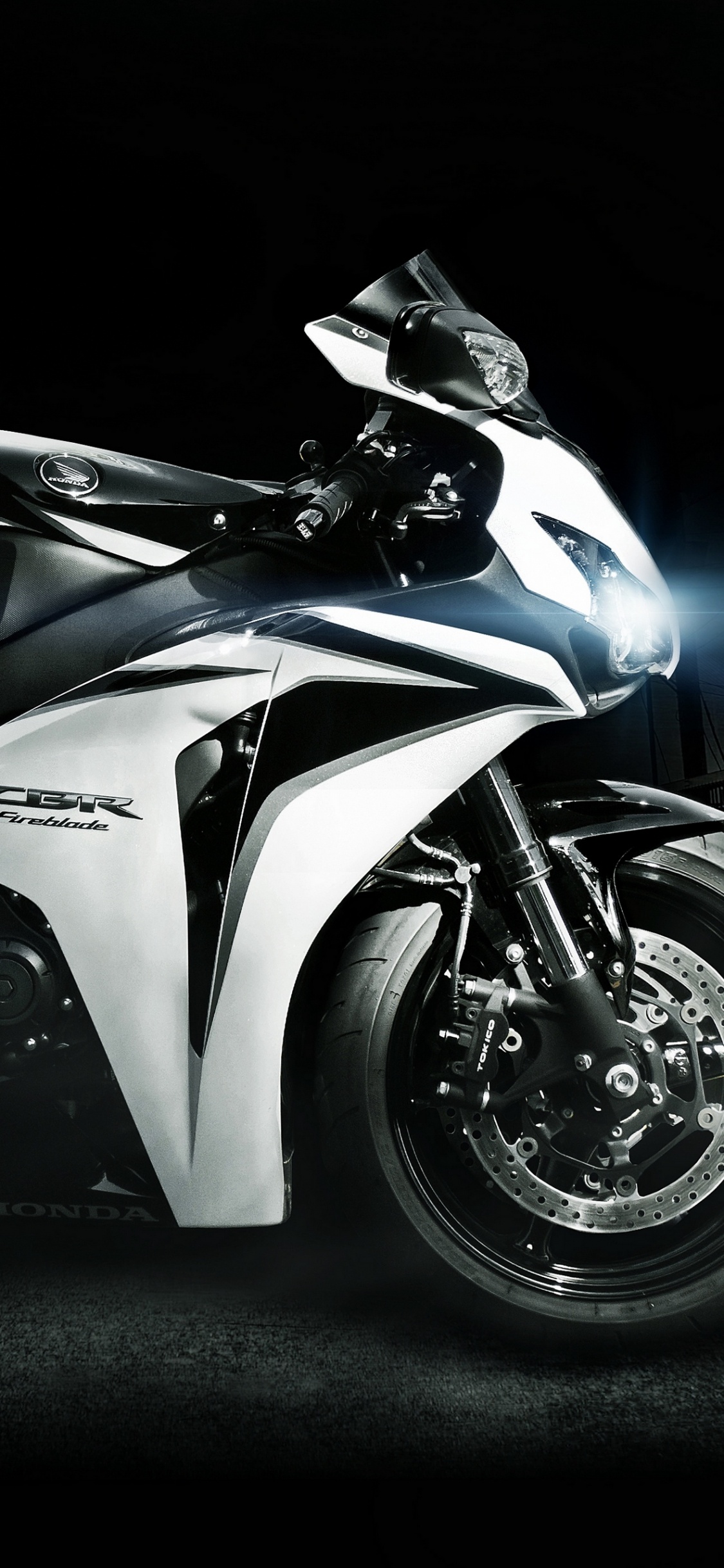 White and Black Sports Bike. Wallpaper in 1125x2436 Resolution