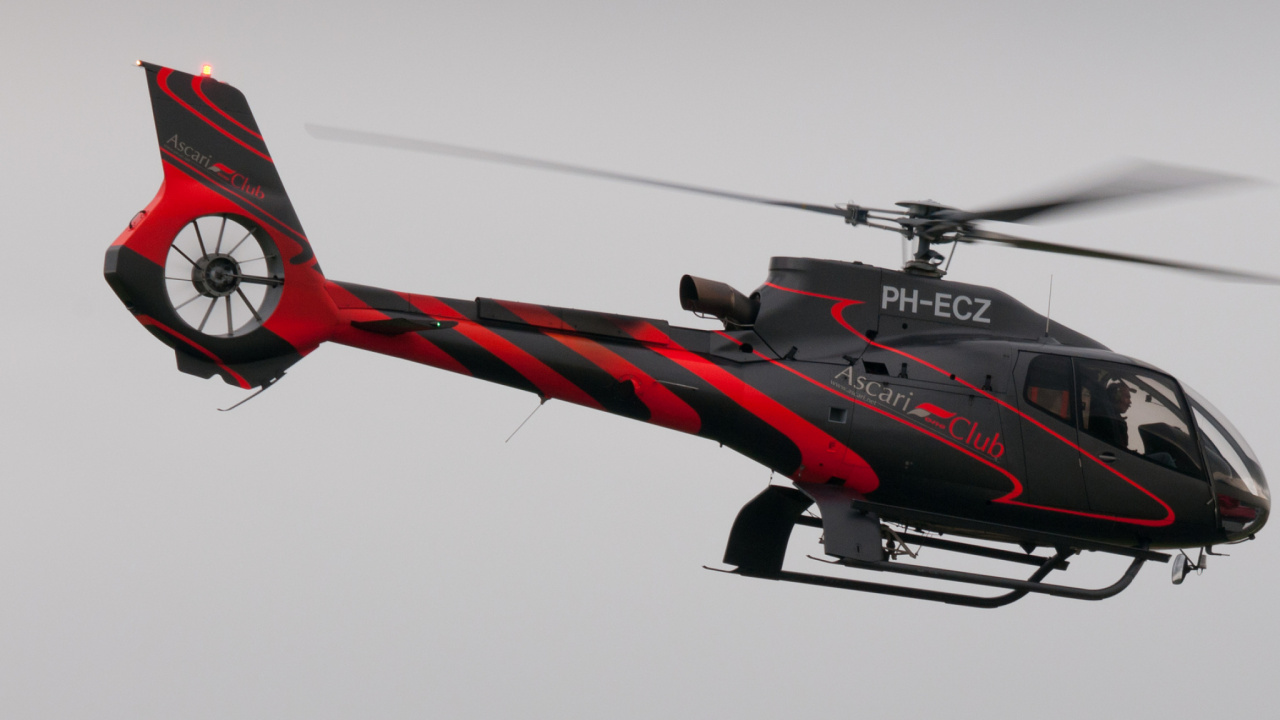 Red and Black Helicopter in Mid Air. Wallpaper in 1280x720 Resolution