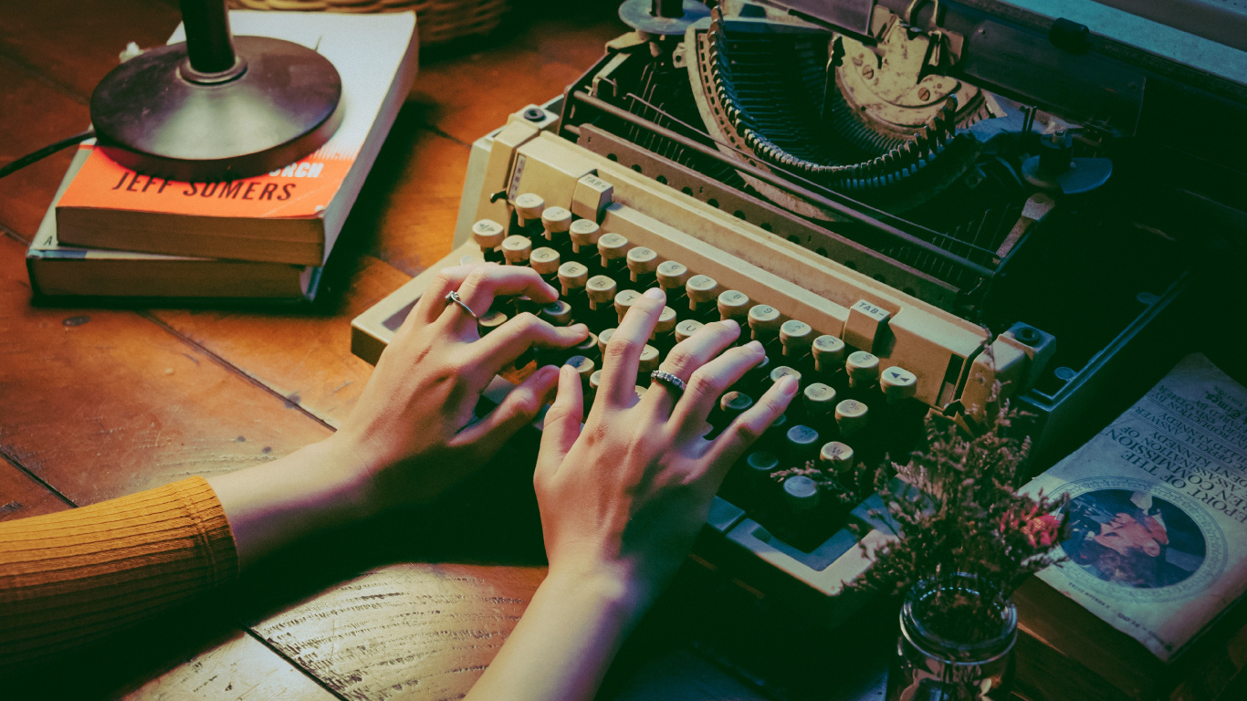 Person Using Typewriter on Table. Wallpaper in 1366x768 Resolution