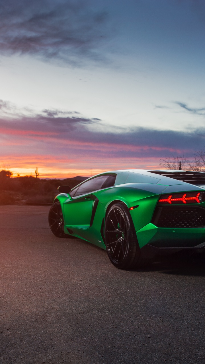 Green Porsche 911 on Brown Sand During Sunset. Wallpaper in 720x1280 Resolution