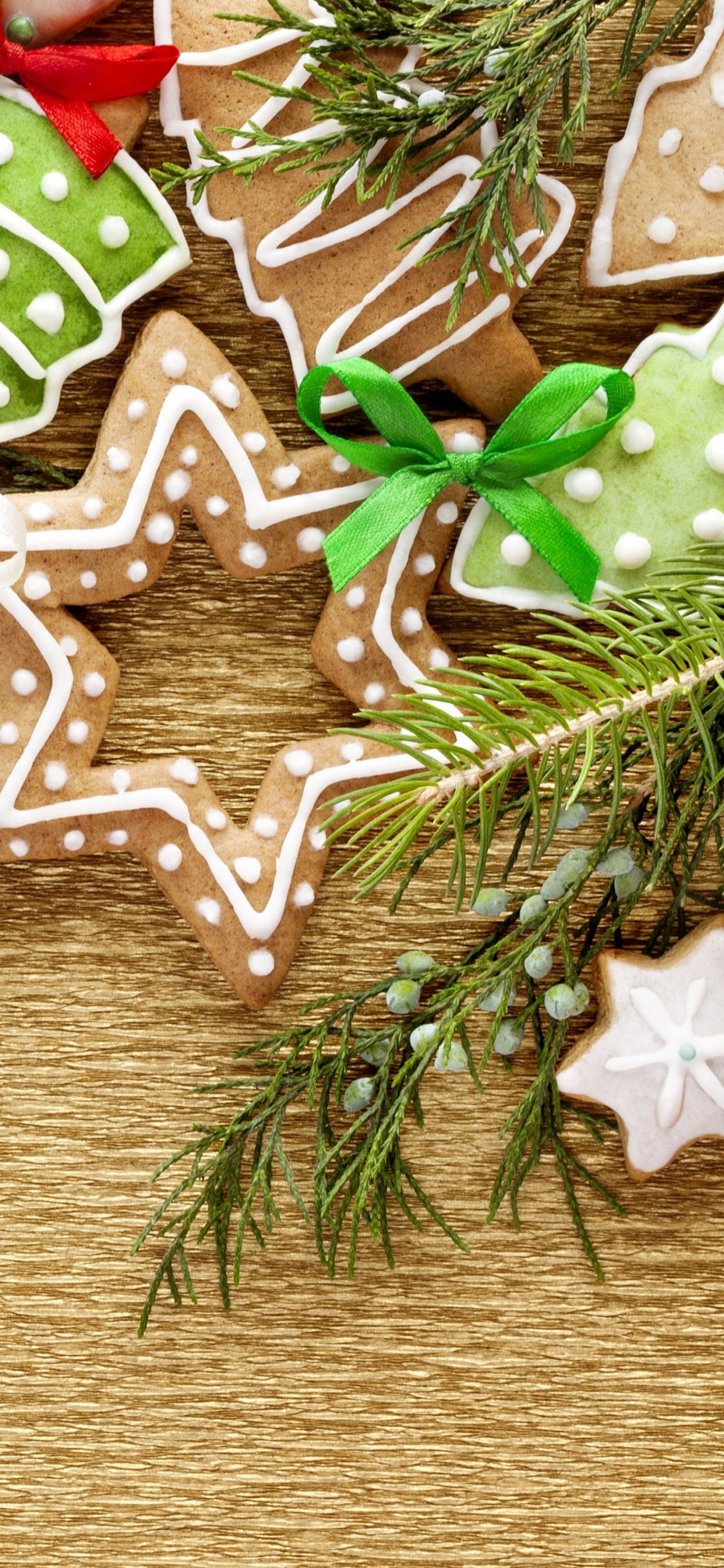 Green and White Christmas Tree With Baubles. Wallpaper in 1125x2436 Resolution