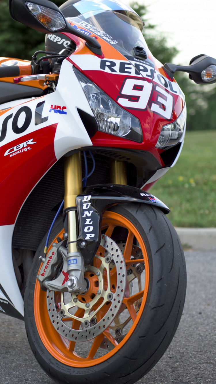 Red and White Honda Sports Bike on Road During Daytime. Wallpaper in 750x1334 Resolution