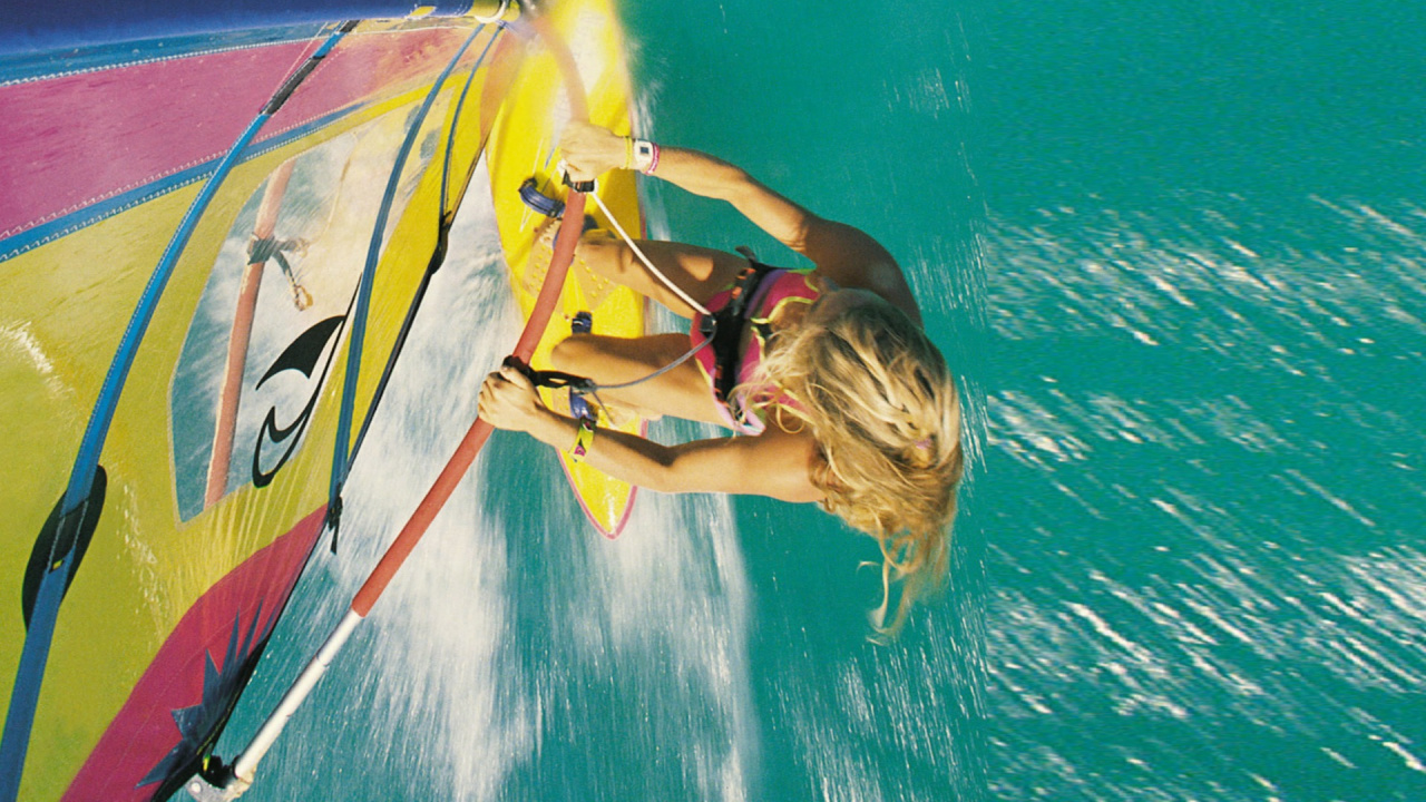 Woman in Yellow and Blue Wetsuit Riding Yellow and Blue Surfboard. Wallpaper in 1280x720 Resolution