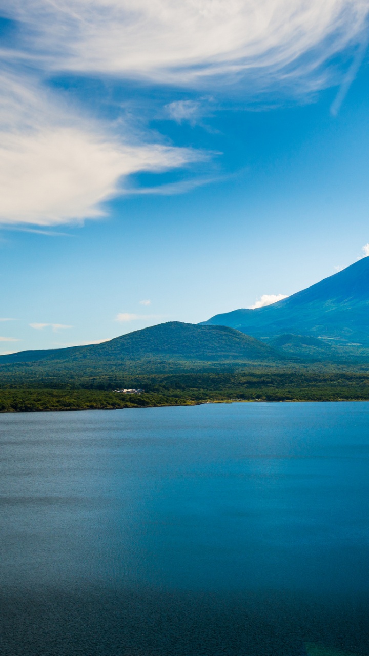 Blue Lake Near Green Mountain Under Blue Sky During Daytime. Wallpaper in 720x1280 Resolution