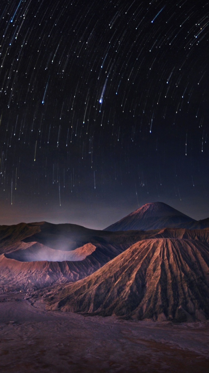 Brown Mountain Under Starry Night. Wallpaper in 720x1280 Resolution