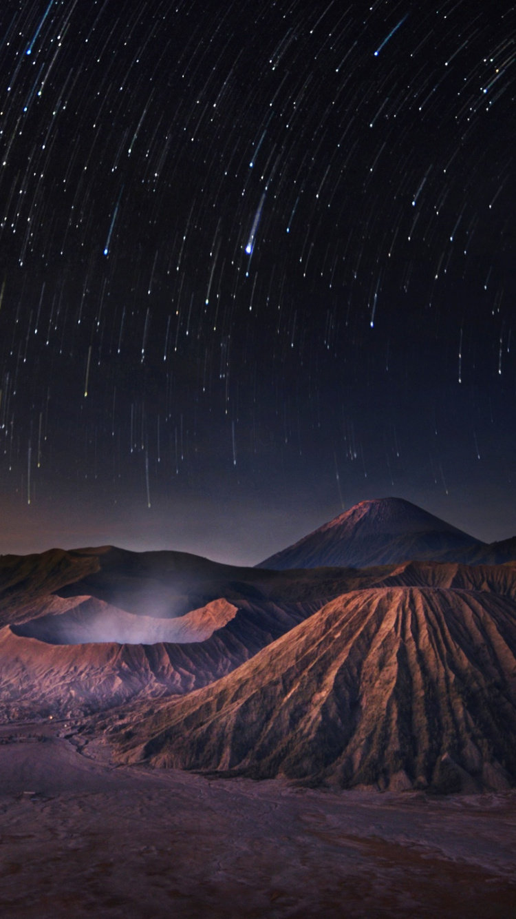 Brown Mountain Under Starry Night. Wallpaper in 750x1334 Resolution