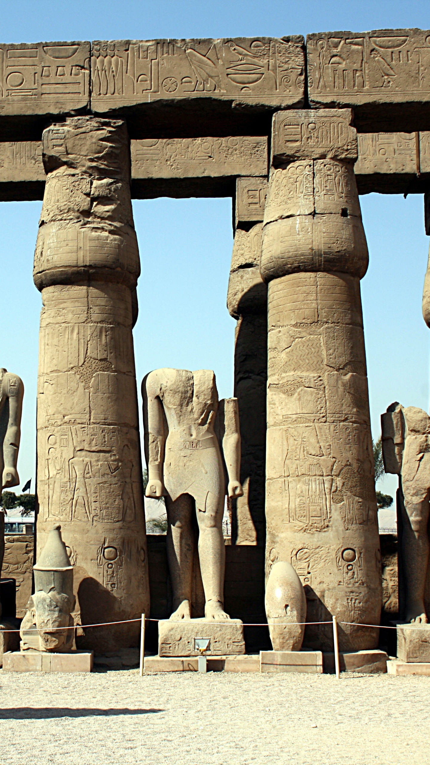 Brown Concrete Statues During Daytime. Wallpaper in 1440x2560 Resolution