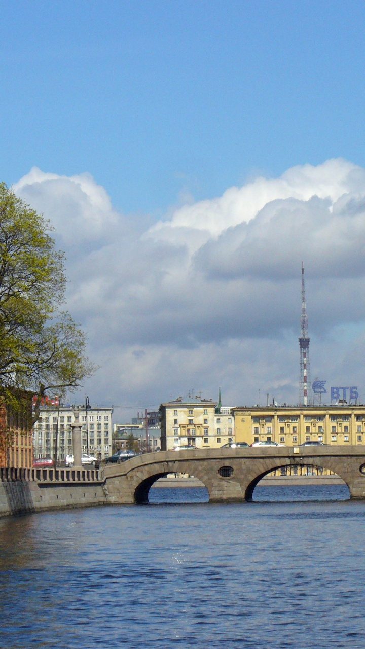 White Concrete Bridge Over River Under Blue Sky During Daytime. Wallpaper in 720x1280 Resolution