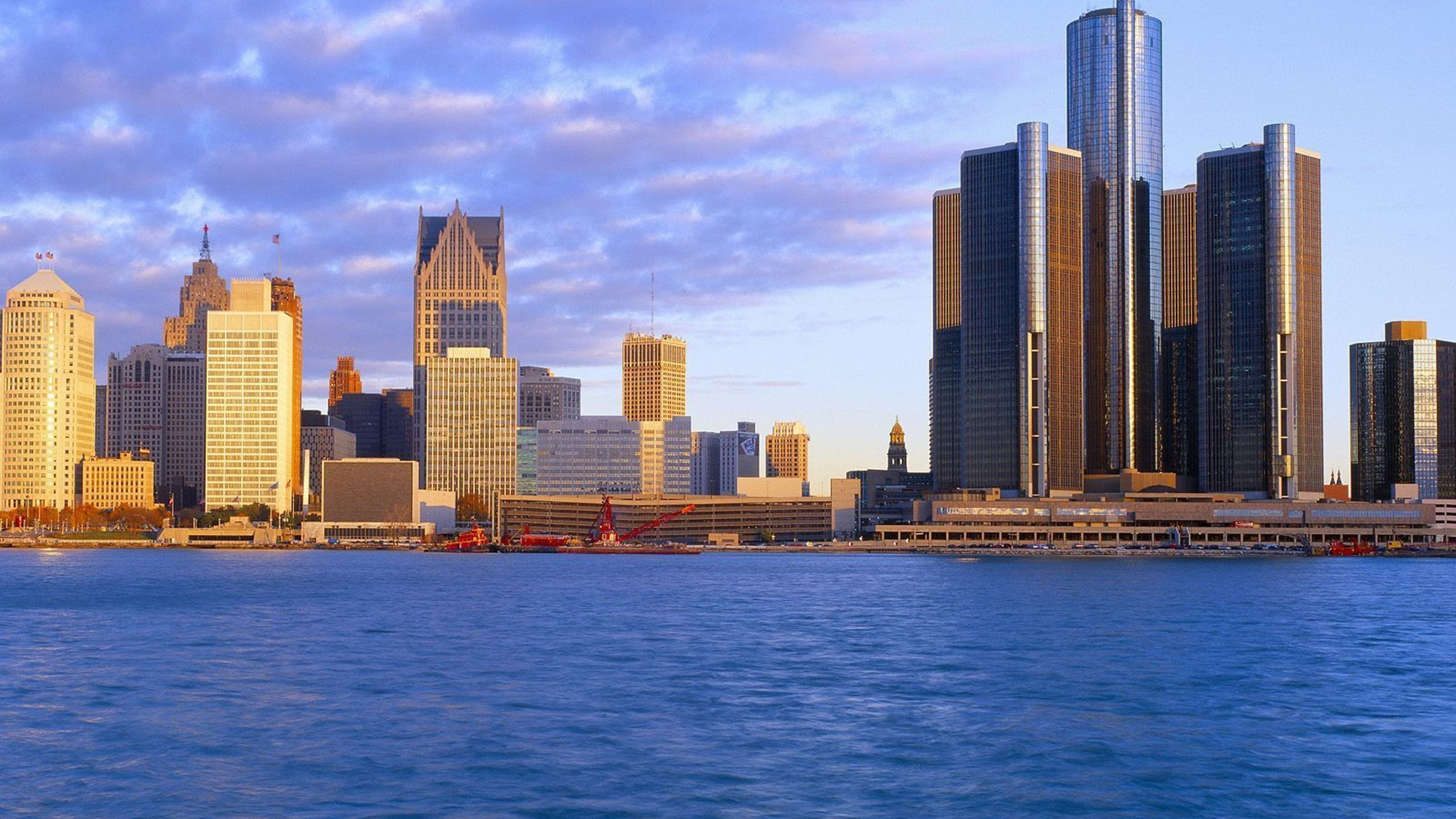 City Skyline Across Body of Water During Daytime. Wallpaper in 2560x1440 Resolution