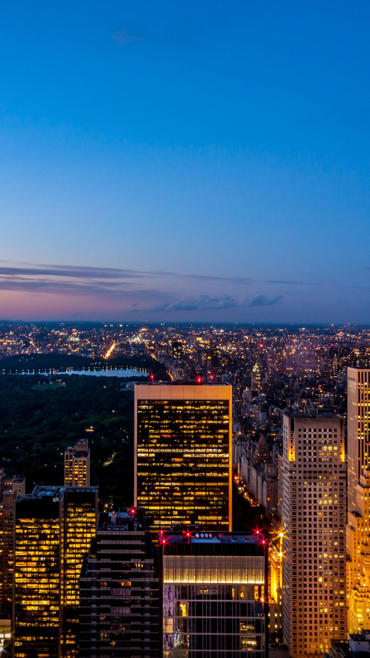 Aerial View of City Buildings During Night Time. Wallpaper in 750x1334 Resolution