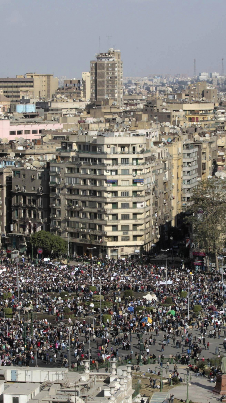 People on Park Near High Rise Buildings During Daytime. Wallpaper in 750x1334 Resolution