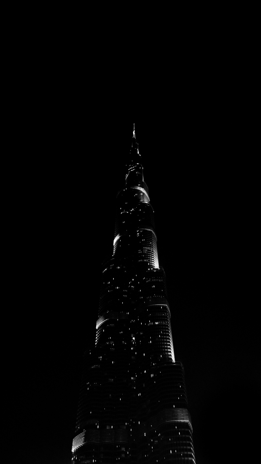 Schwarzer Turm Mit Lichtern Während Der Nacht. Wallpaper in 1080x1920 Resolution