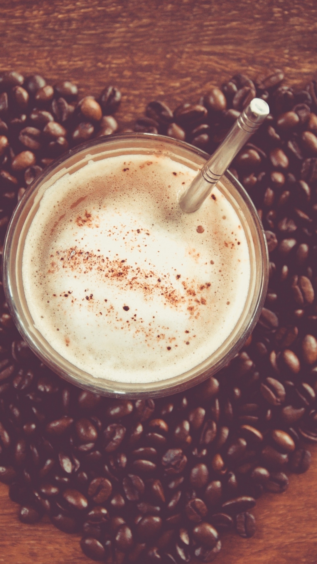 White Liquid in Clear Drinking Glass on Brown Coffee Beans. Wallpaper in 1080x1920 Resolution