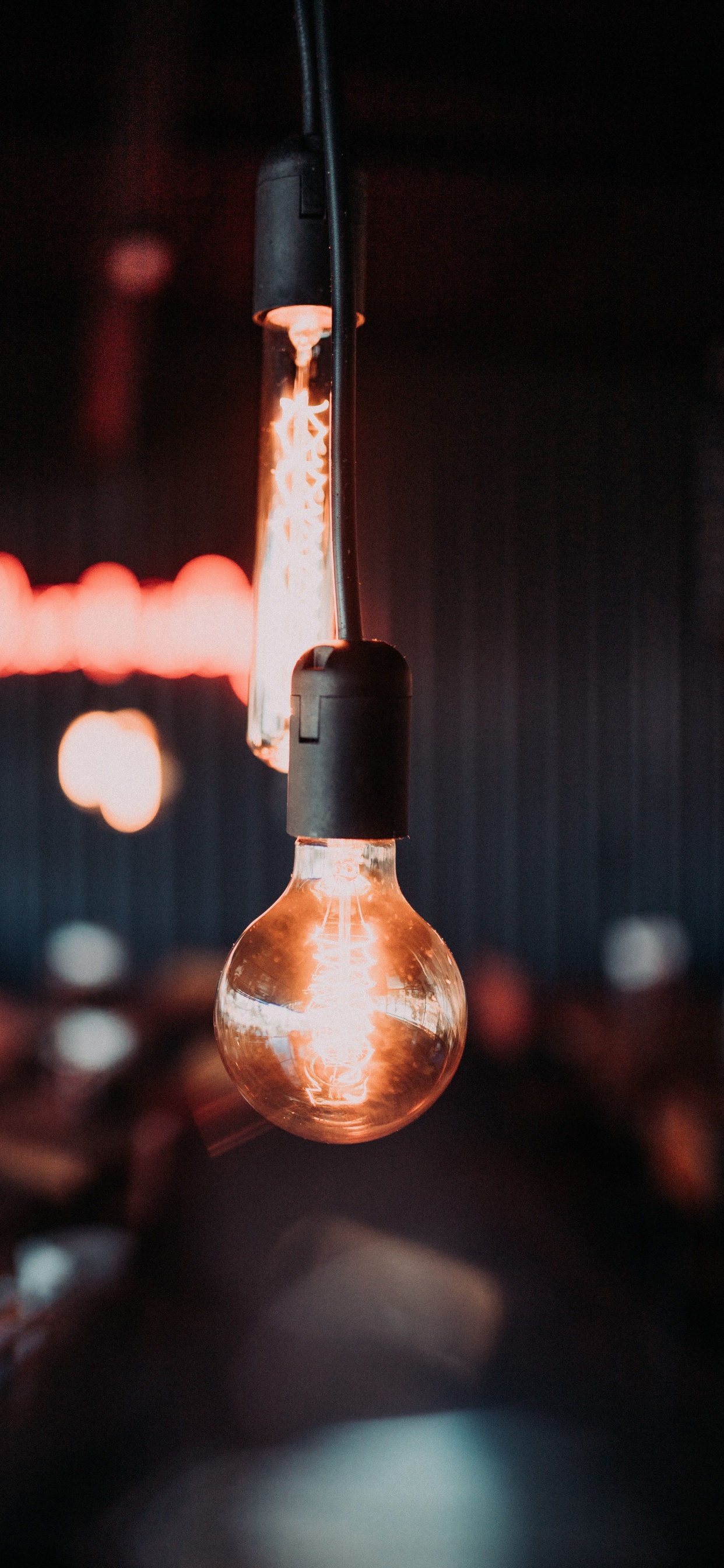 Brown Light Bulb in Tilt Shift Lens. Wallpaper in 1242x2688 Resolution