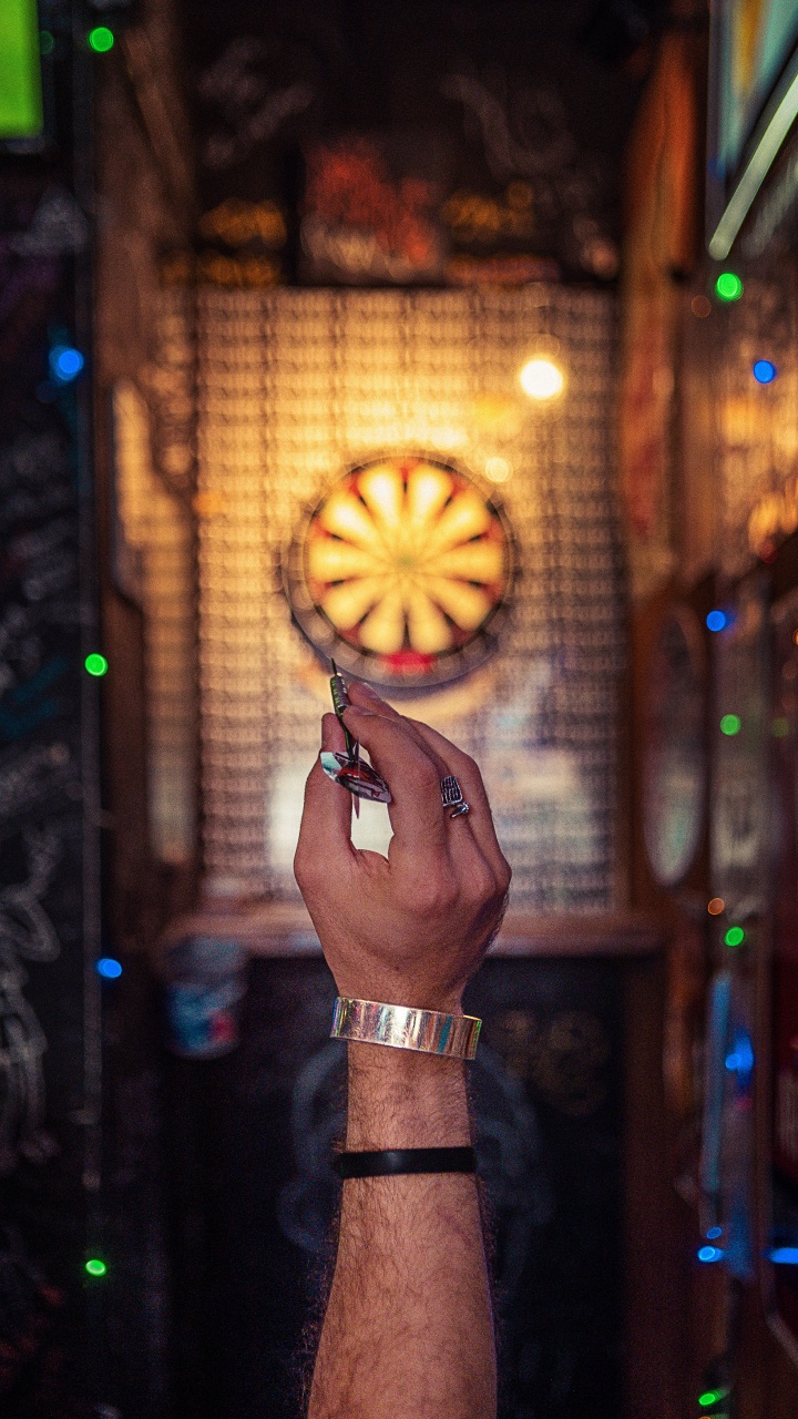Person Holding Lighted Jack o Lantern. Wallpaper in 720x1280 Resolution