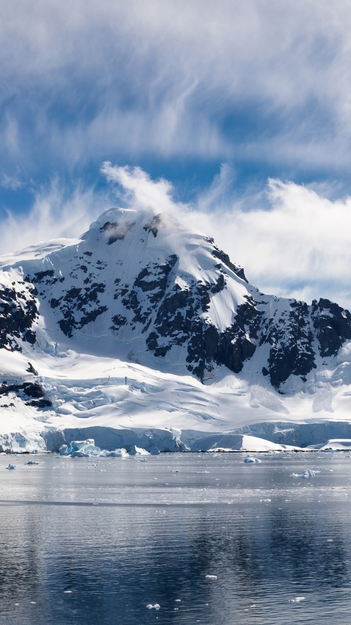 Snow Covered Mountain Near Body of Water During Daytime. Wallpaper in 720x1280 Resolution