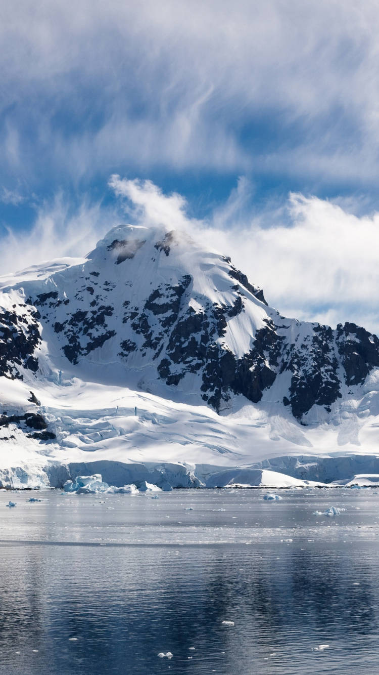 Snow Covered Mountain Near Body of Water During Daytime. Wallpaper in 750x1334 Resolution