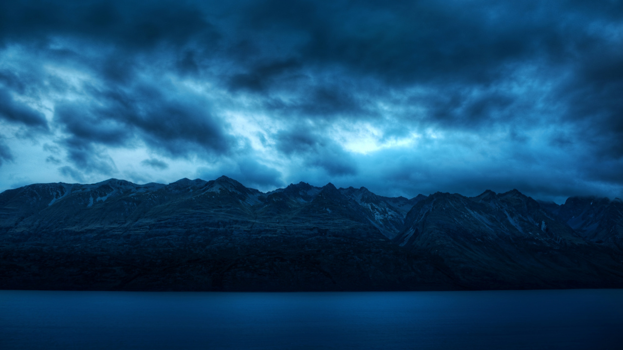 Black and White Mountains Under Gray Clouds. Wallpaper in 1280x720 Resolution