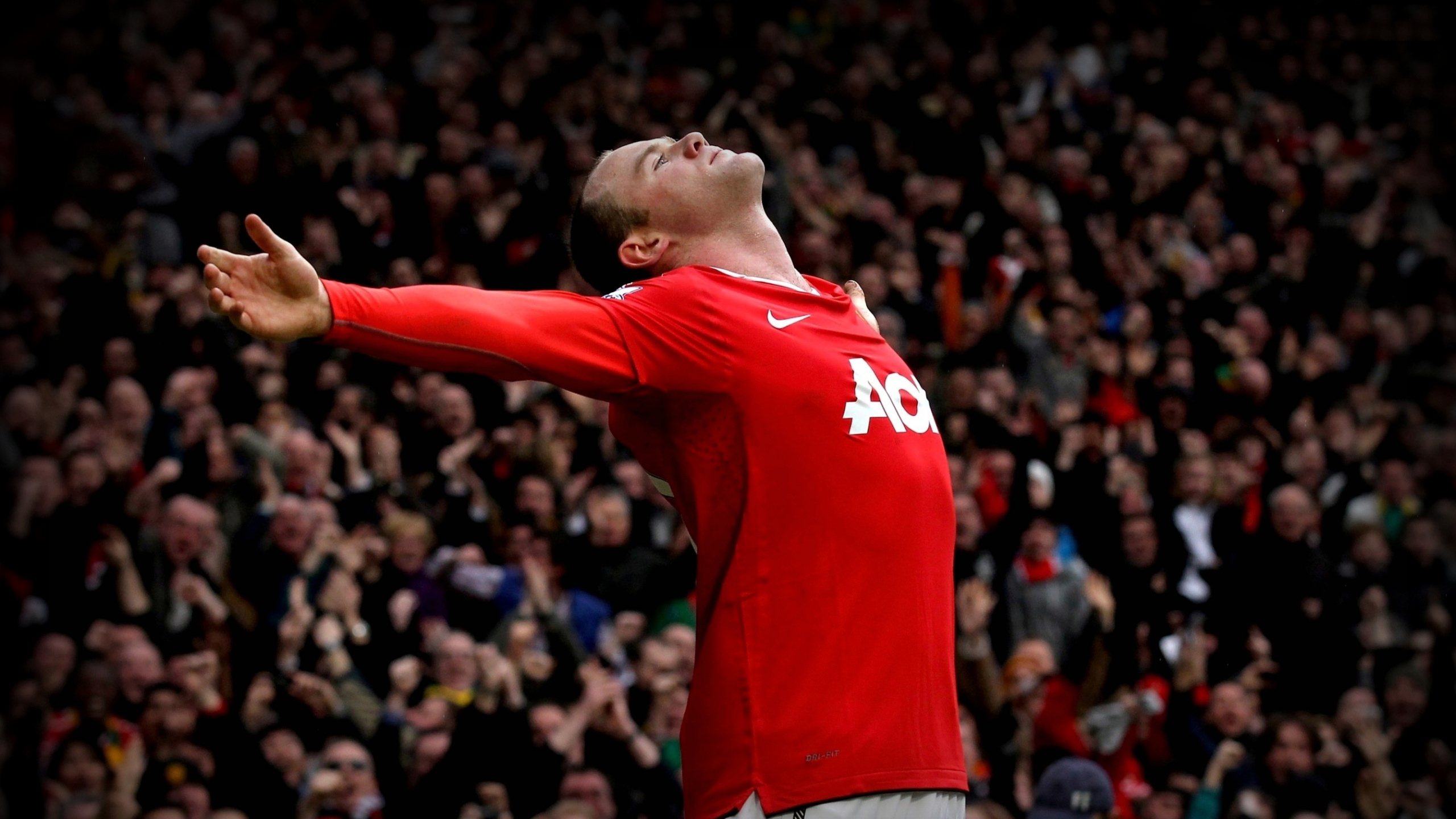 Man in Red Nike Crew Neck T-shirt and Blue Shorts. Wallpaper in 2560x1440 Resolution