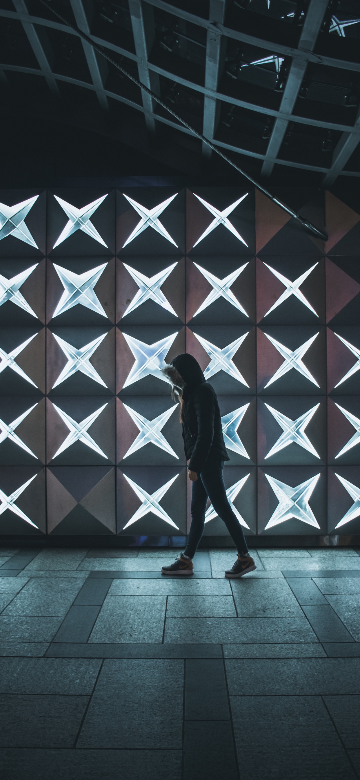 Man in Black Jacket Standing on Brown Wooden Floor. Wallpaper in 1242x2688 Resolution