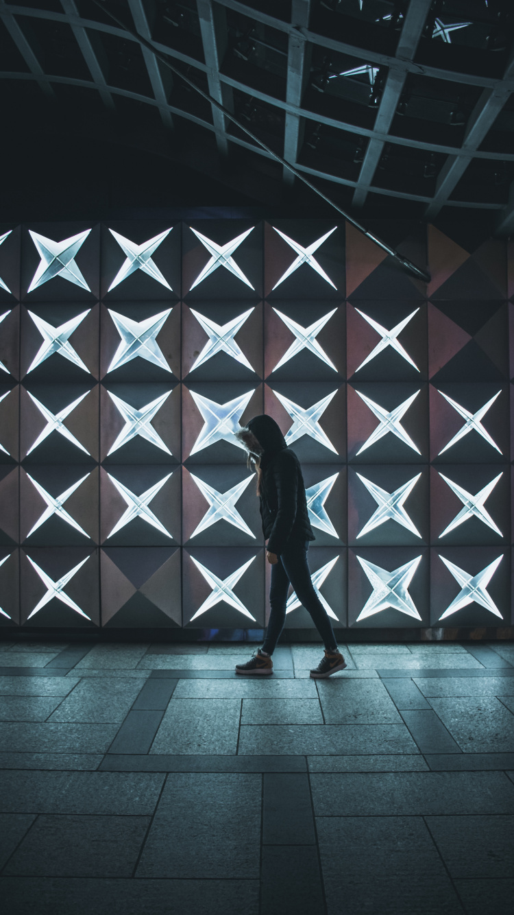Man in Black Jacket Standing on Brown Wooden Floor. Wallpaper in 750x1334 Resolution