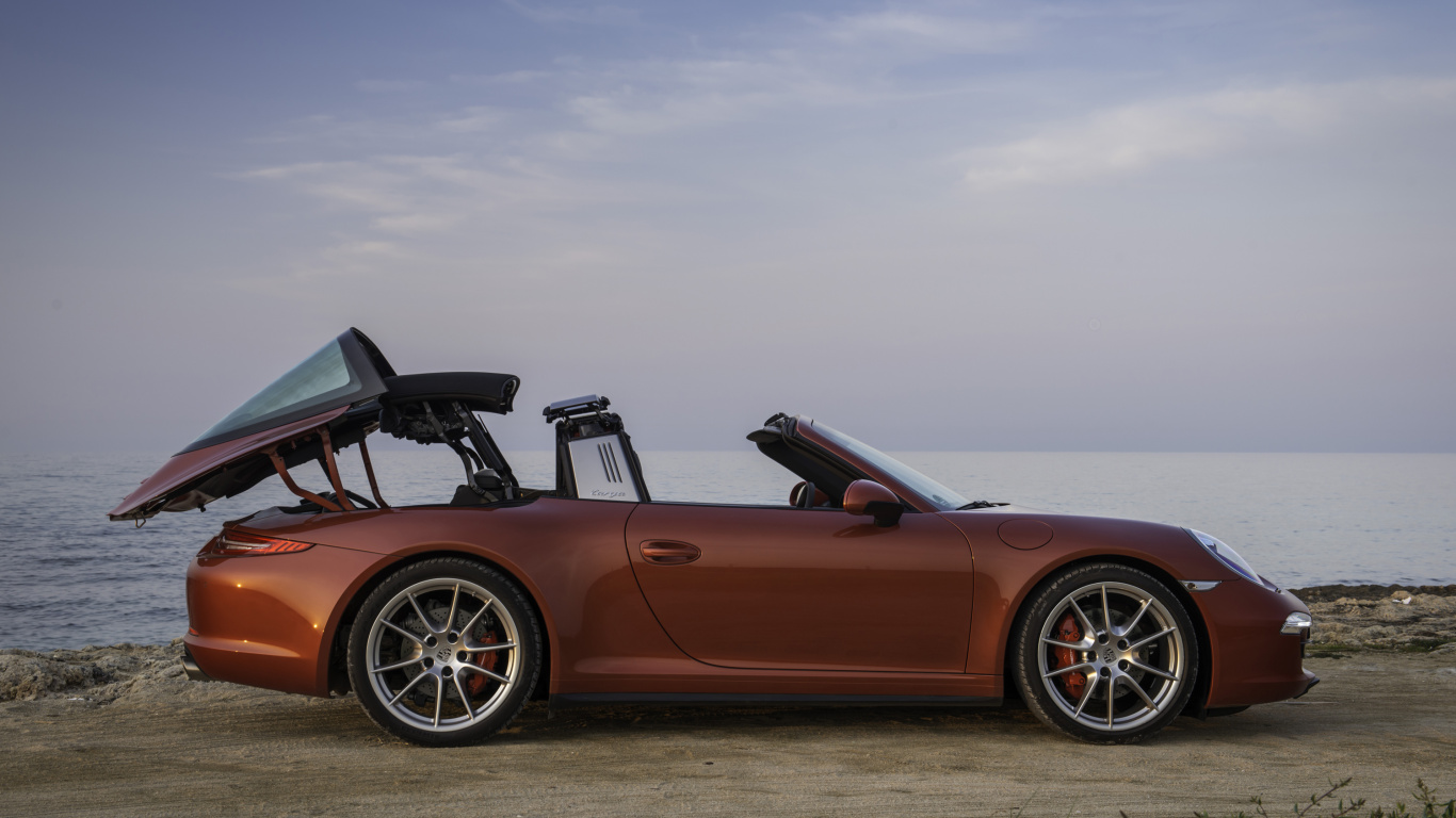 Brown Convertible Coupe on Green Grass Field Under White Clouds During Daytime. Wallpaper in 1366x768 Resolution