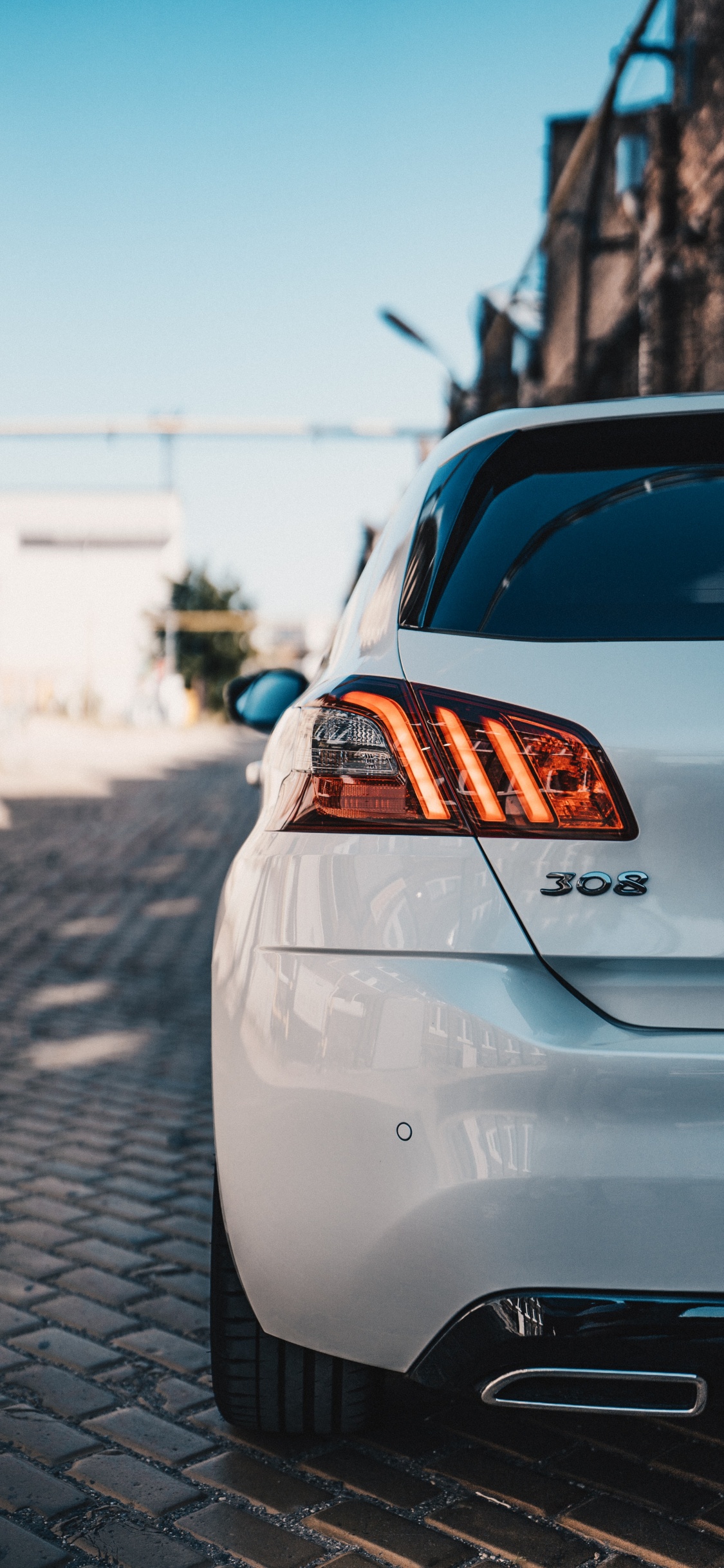 White Car on Road During Daytime. Wallpaper in 1125x2436 Resolution