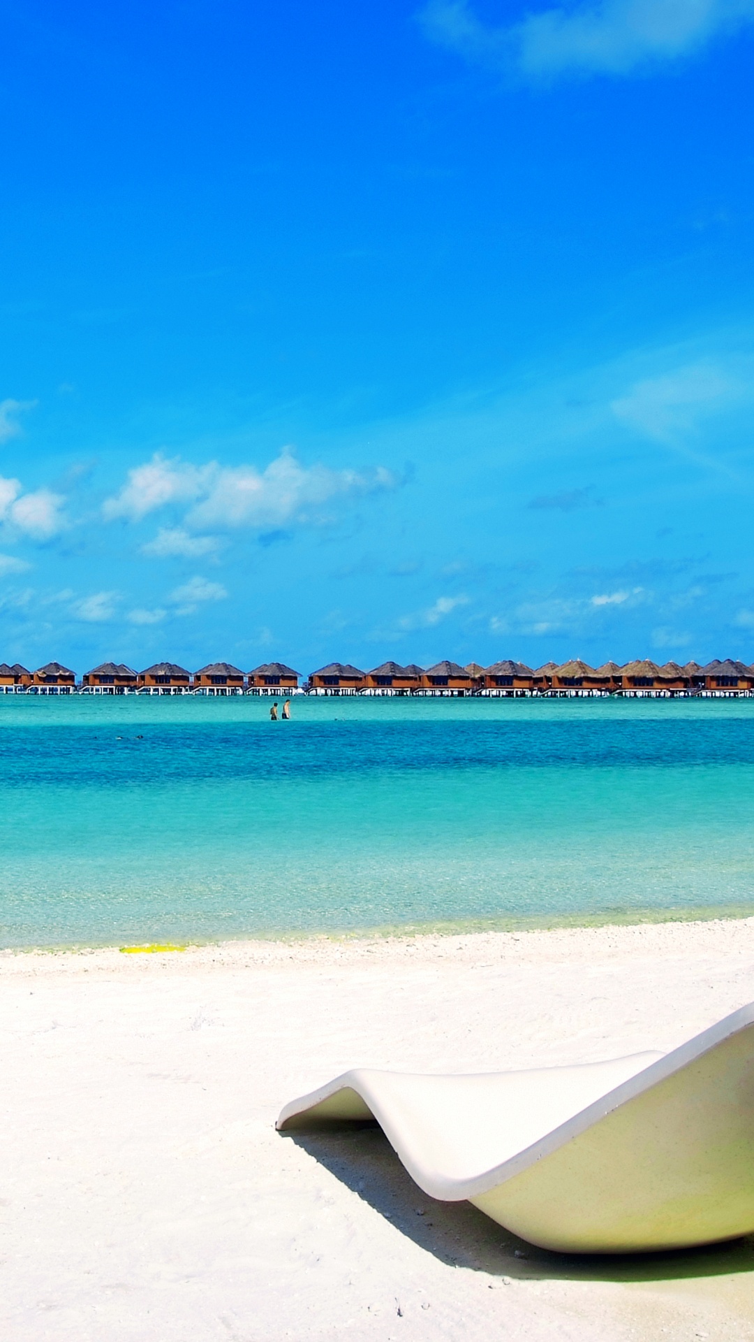 White and Blue Beach Chair on White Sand Near Body of Water During Daytime. Wallpaper in 1080x1920 Resolution