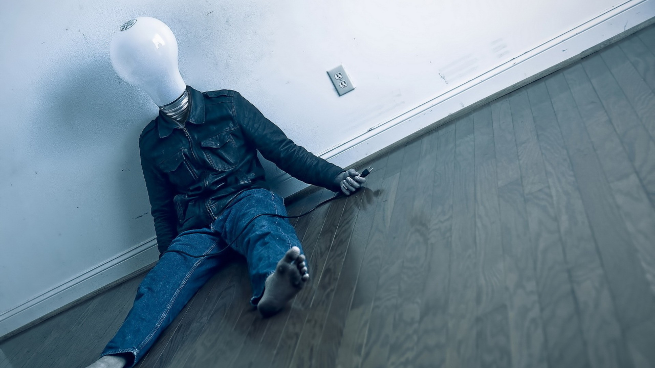 Man in Black Leather Jacket and Blue Denim Jeans Sitting on Floor. Wallpaper in 1280x720 Resolution