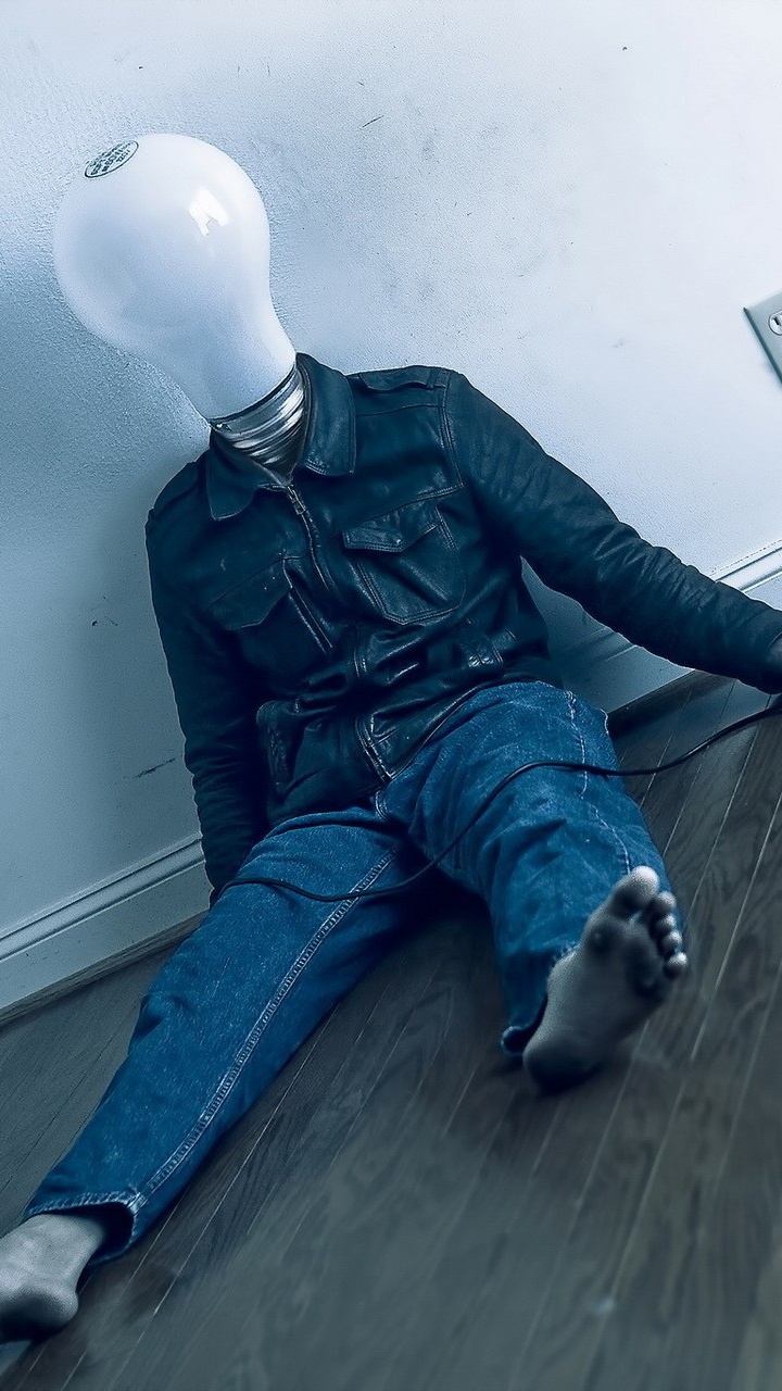 Man in Black Leather Jacket and Blue Denim Jeans Sitting on Floor. Wallpaper in 720x1280 Resolution