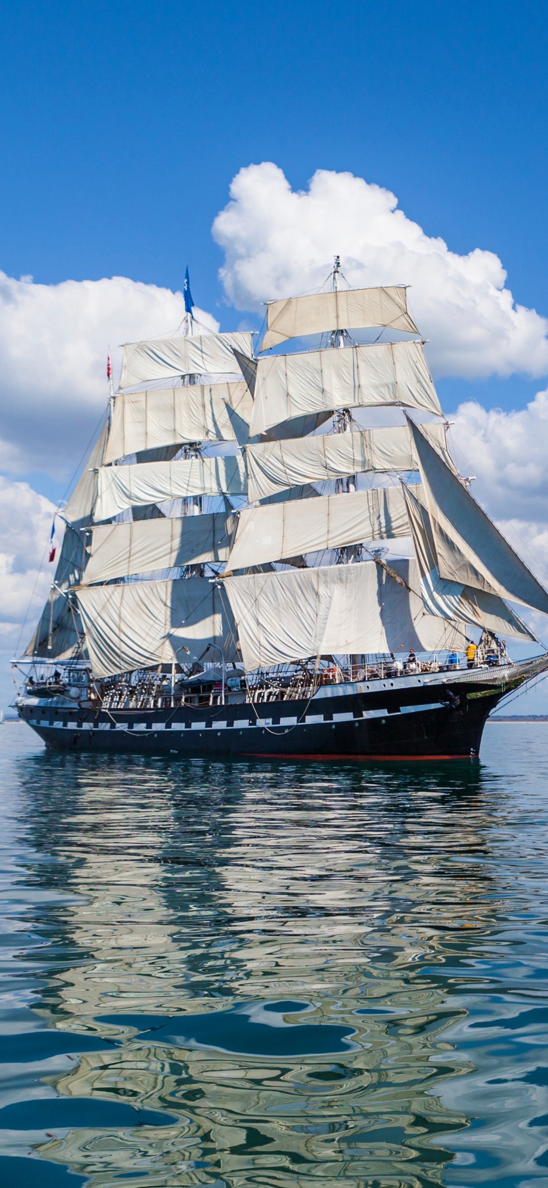 Brown and White Sail Boat on Sea Under Blue Sky During Daytime. Wallpaper in 1125x2436 Resolution