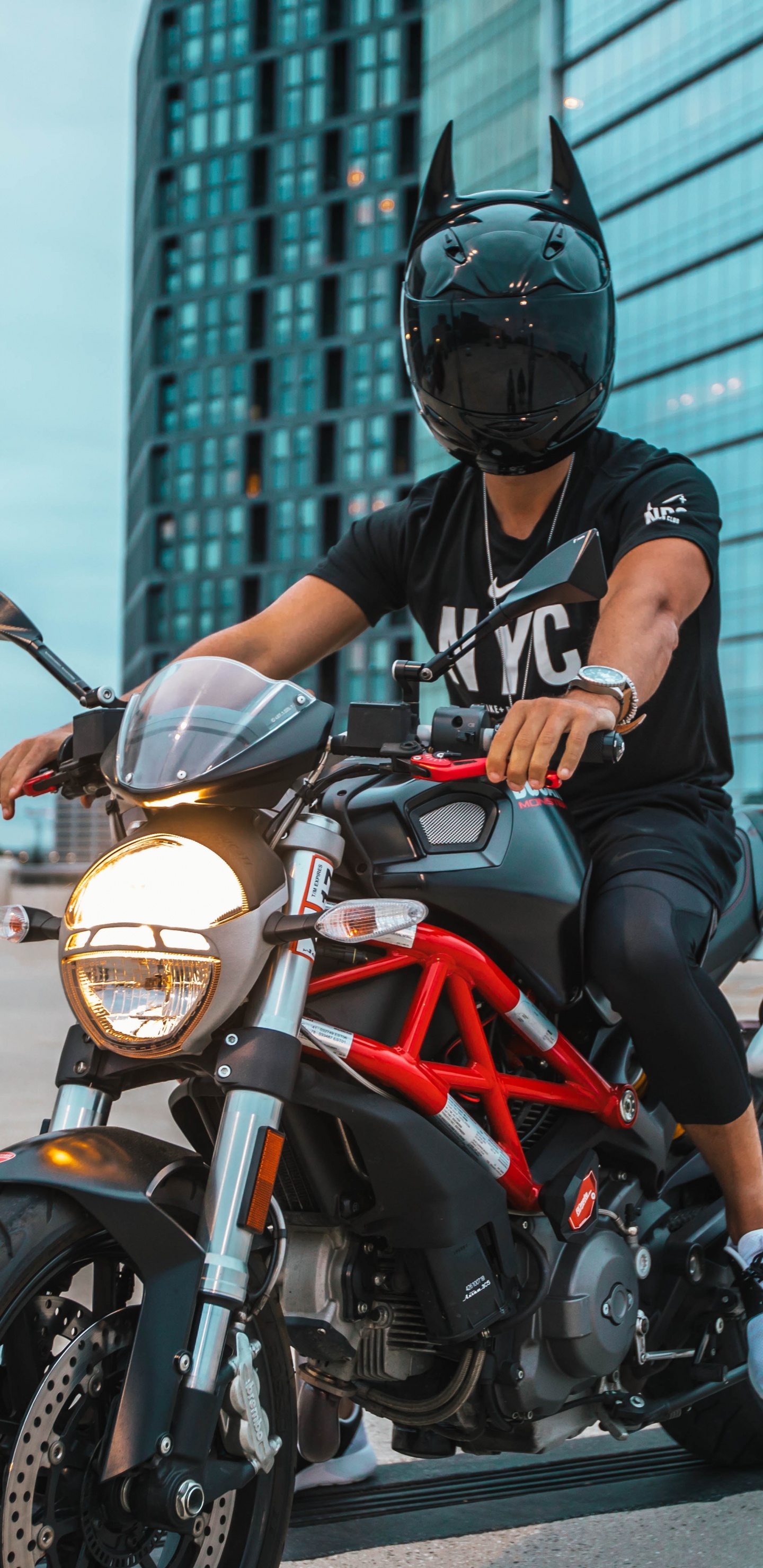 Man in Black Helmet Riding on Orange and Black Motorcycle. Wallpaper in 1440x2960 Resolution