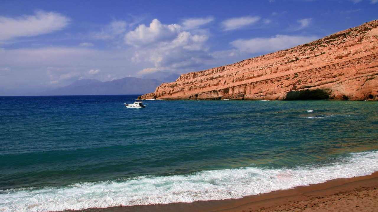 White Boat on Sea Near Brown Rock Formation Under Blue Sky During Daytime. Wallpaper in 1280x720 Resolution