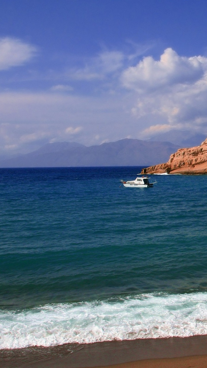 White Boat on Sea Near Brown Rock Formation Under Blue Sky During Daytime. Wallpaper in 720x1280 Resolution