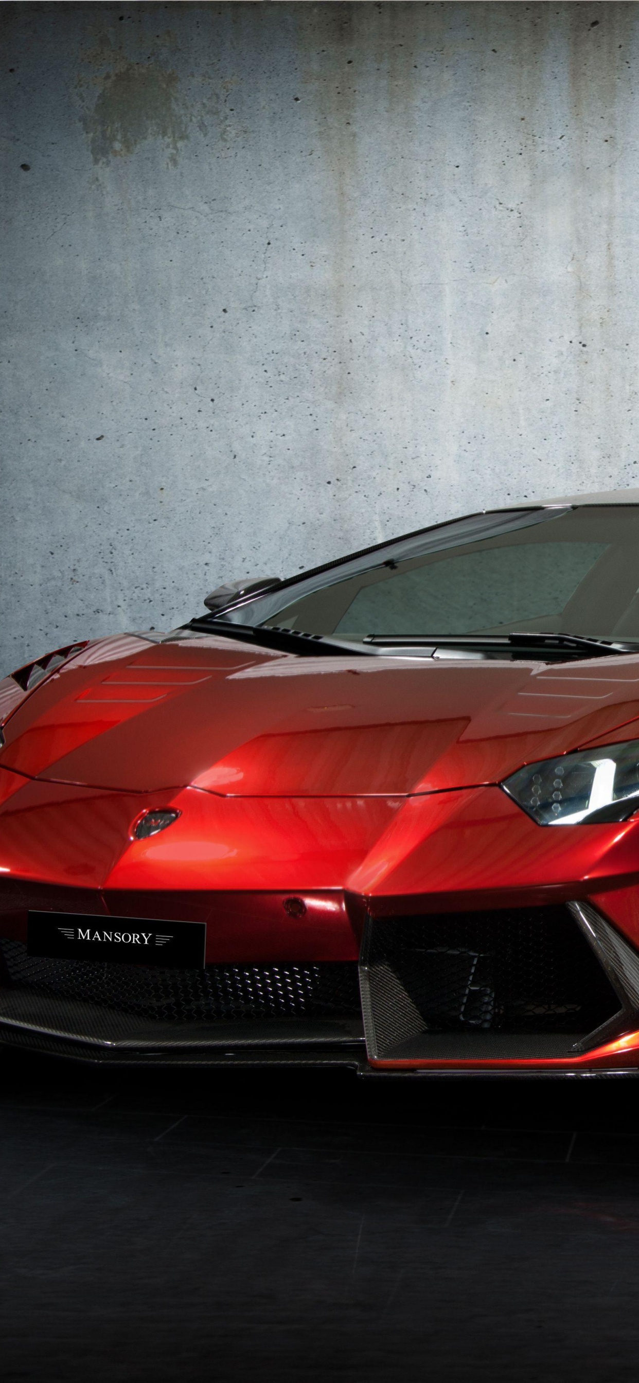 Roter Ferrari 458 Italia Neben Weißer Wand Geparkt. Wallpaper in 1242x2688 Resolution