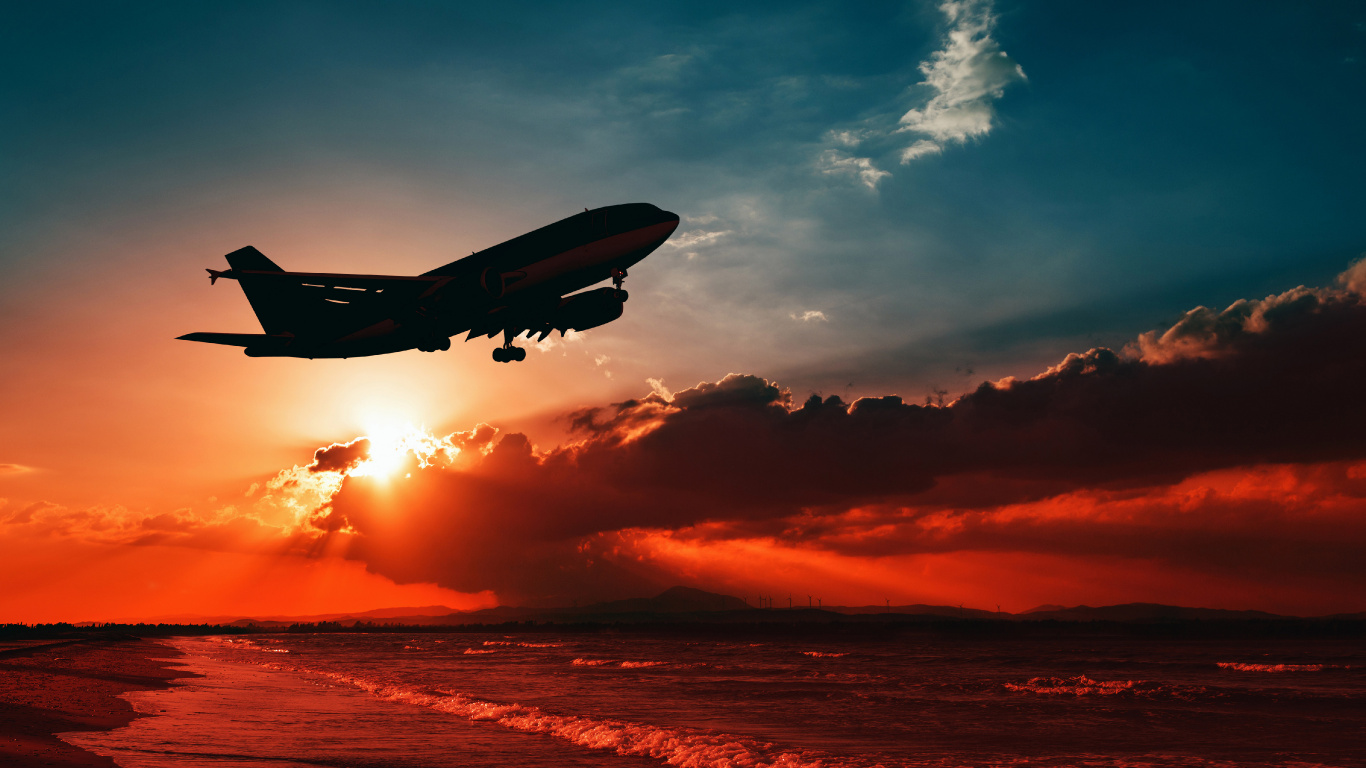 Airplane Flying Over The Clouds During Sunset. Wallpaper in 1366x768 Resolution