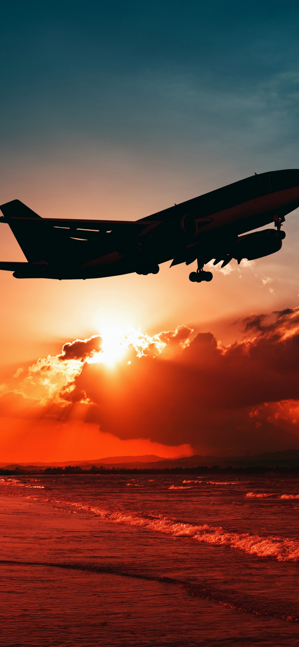 Flugzeug Fliegt Bei Sonnenuntergang Über Den Wolken The. Wallpaper in 1242x2688 Resolution