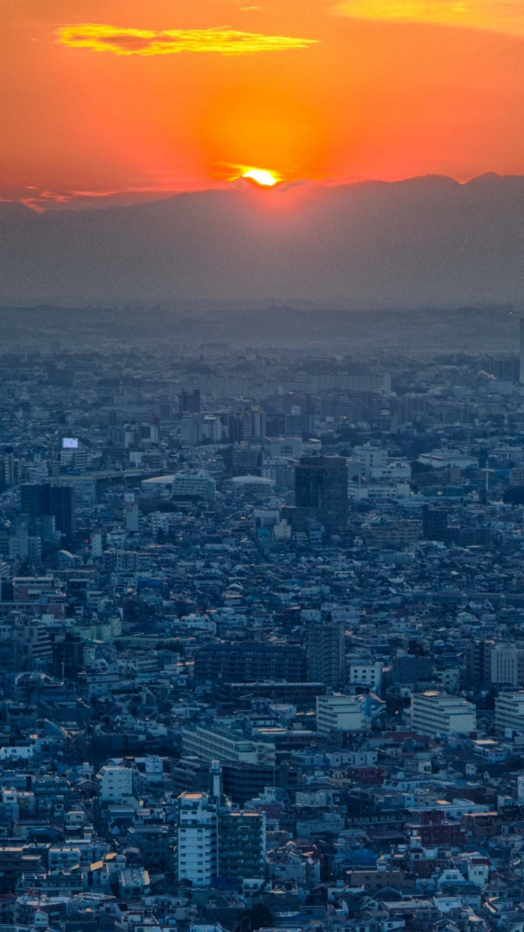 Horizonte de la Ciudad Durante la Hora Dorada. Wallpaper in 750x1334 Resolution