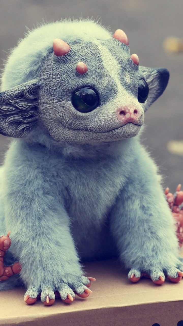 Blue and White Animal Plush Toy on Brown Wooden Table. Wallpaper in 720x1280 Resolution