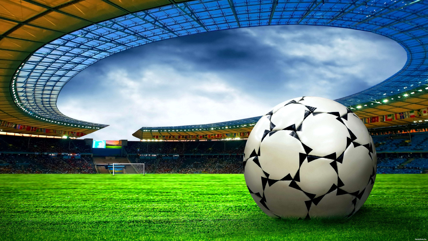 Soccer Ball on Green Grass Field Under White Clouds During Daytime. Wallpaper in 1366x768 Resolution