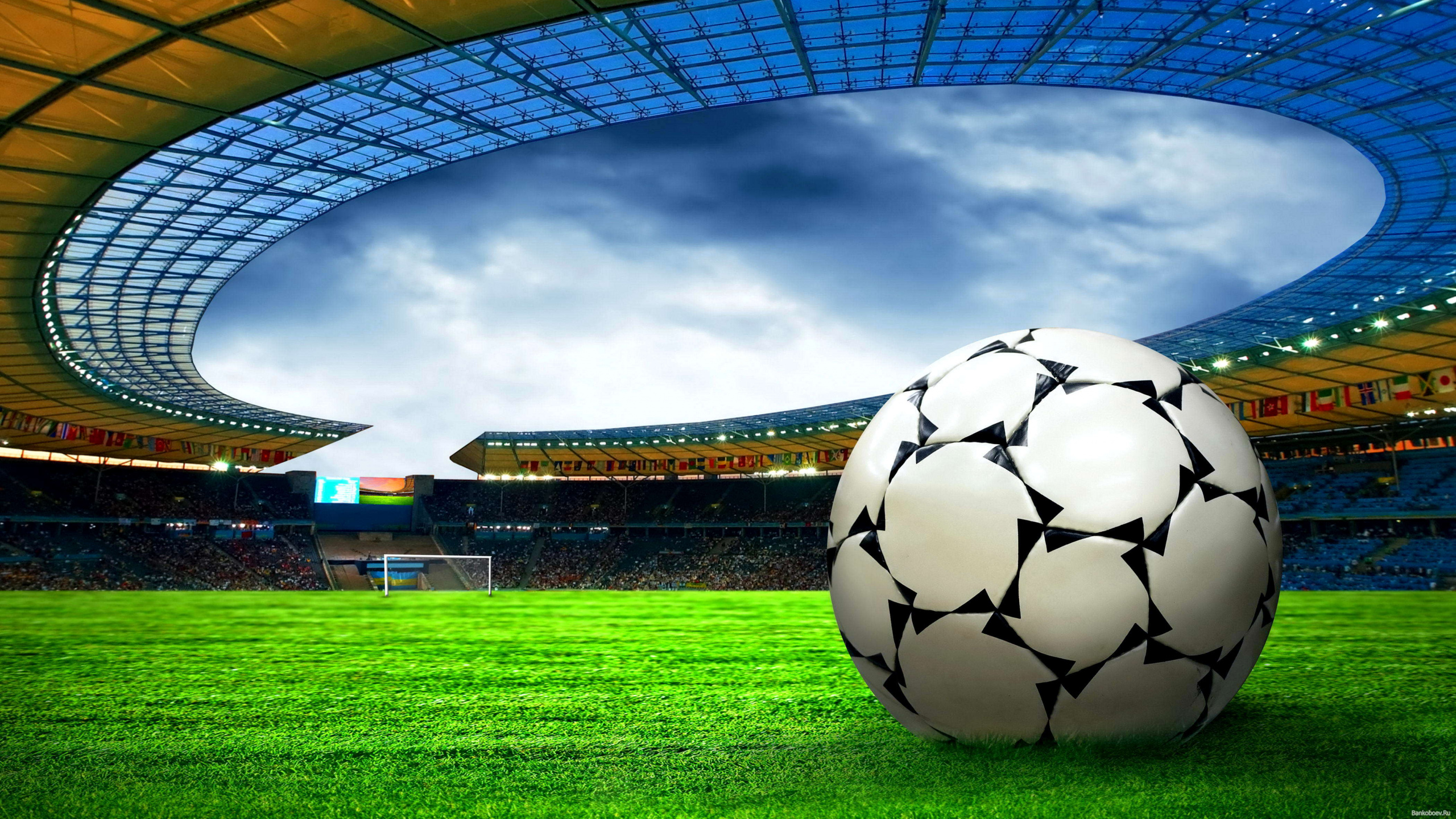 Soccer Ball on Green Grass Field Under White Clouds During Daytime. Wallpaper in 2560x1440 Resolution