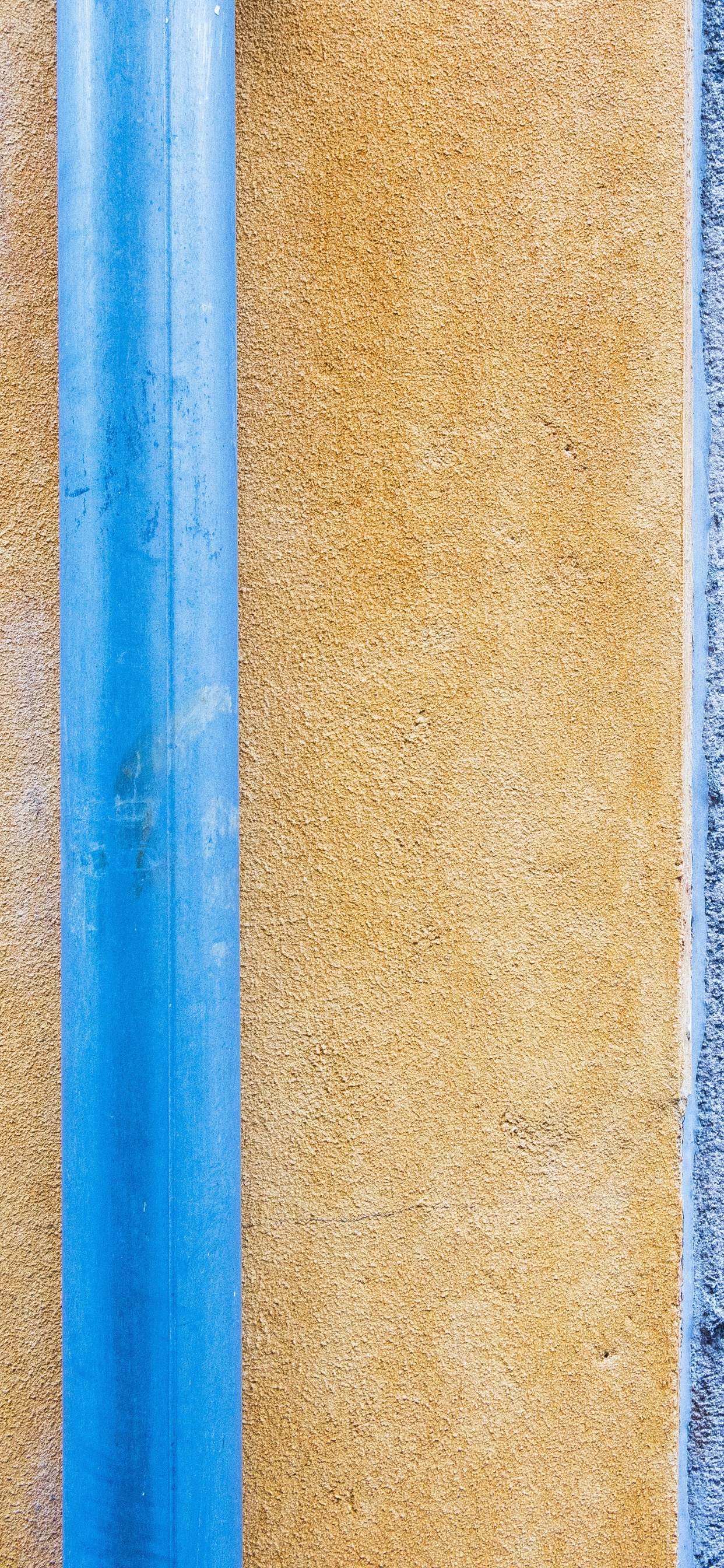 Blue Metal Rod on Brown Concrete Wall. Wallpaper in 1242x2688 Resolution