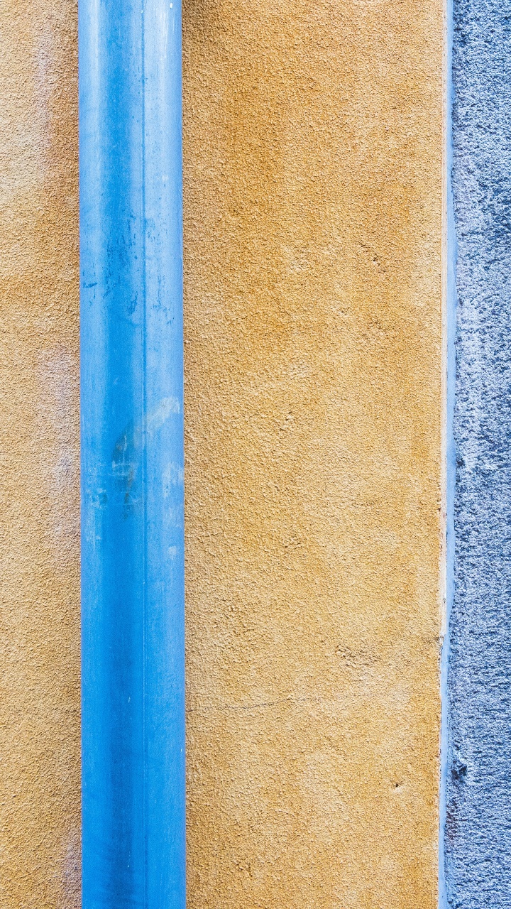 Blue Metal Rod on Brown Concrete Wall. Wallpaper in 720x1280 Resolution