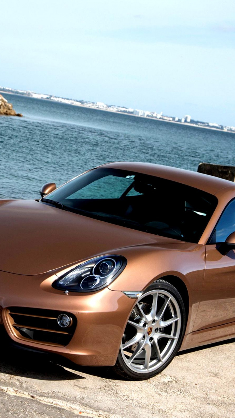 Porsche 911 Negro Estacionado en la Orilla Del Mar Durante el Día. Wallpaper in 750x1334 Resolution