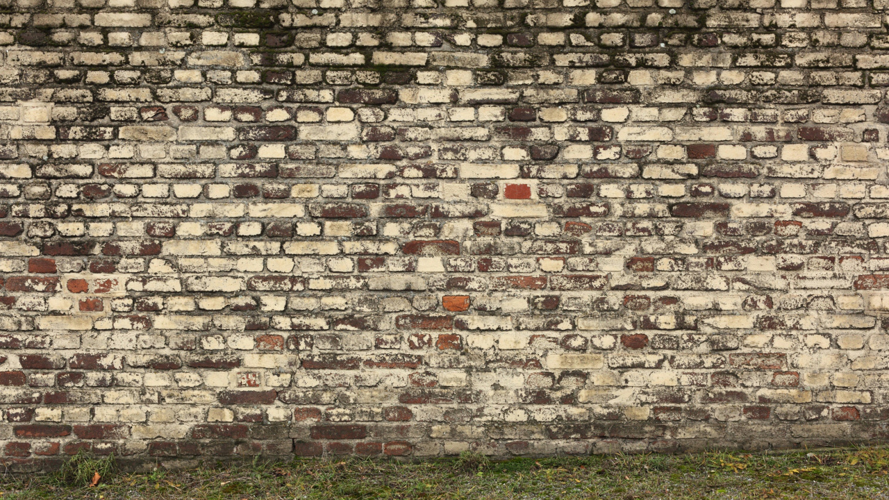 Brown Brick Wall With Green Grass Field. Wallpaper in 1280x720 Resolution